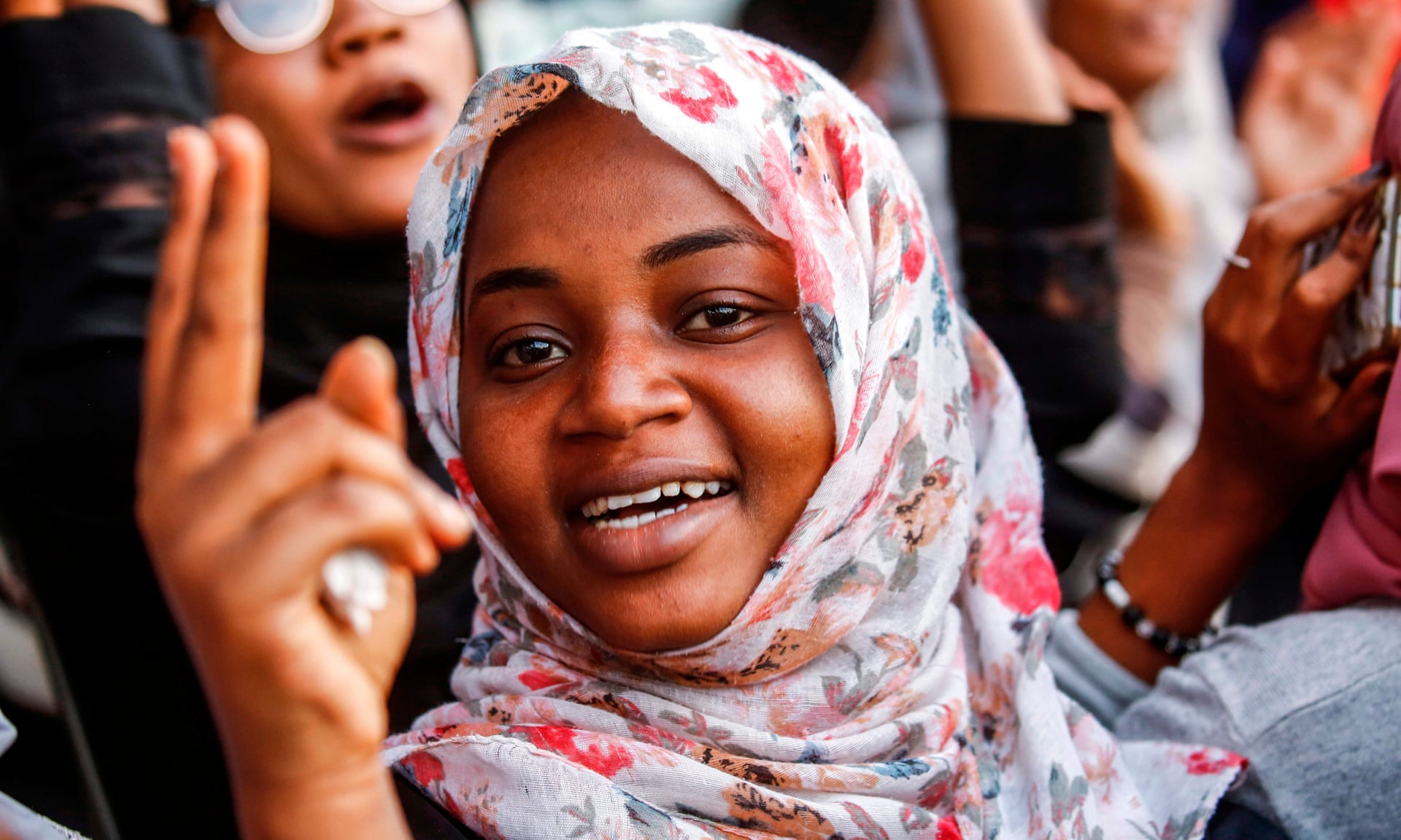 Sudanese woman chants slogans during a demonstration outside the army headquarters in the capital Khartoum
